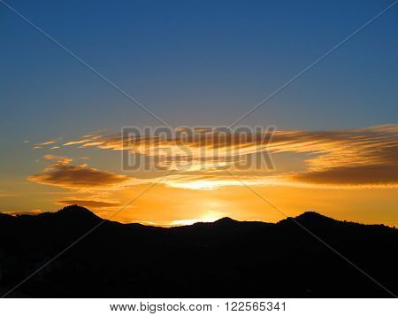 Orange Sunrise Over Hills