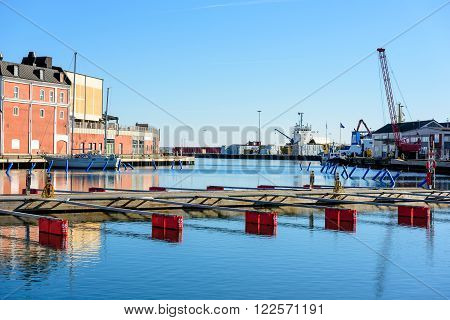 Kalmar Sweden - March 17 2016: Kalmar marina in early spring on a clam and still day. Loading docks in the background. Very few boats moored.