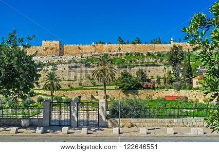 The Kidron Valley and the medieval walls of the old Jerusalem on the background Israel.