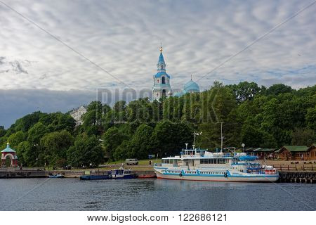VALAAM ISLAND, RUSSIA - JULY 29, 2015: Ferry boat at the quay of Valaam monastery. About 100,000 pilgrims arrive in the Valaam monastery annually, 90,000 of which are tourists
