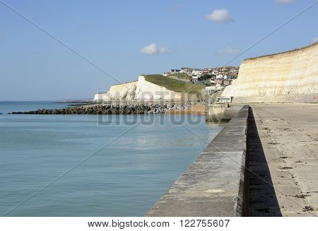 Seafront and cliffs at Rottingdean near Brighton East Sussex England. With unrecognisable people in background