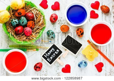 Easter eggs painting colorful background. Homemade crafts preparation on Happy Easter holiday top view