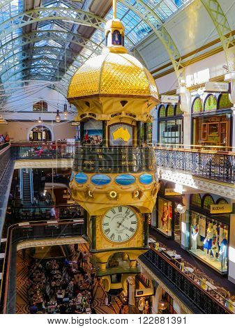 Sydney, Australia - February 02, 2015: Golden clock tower in shopping center with calendar and time and decorations