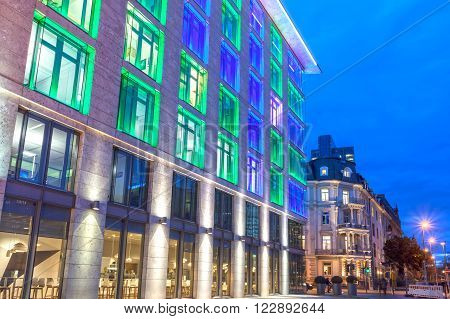 FRANKFURT GERMANY - MAR 15: Colorful illuminated office building in the city of Frankfurt Main at the Luminale 2016 festival. March 15 2016 in Frankfurt Germany