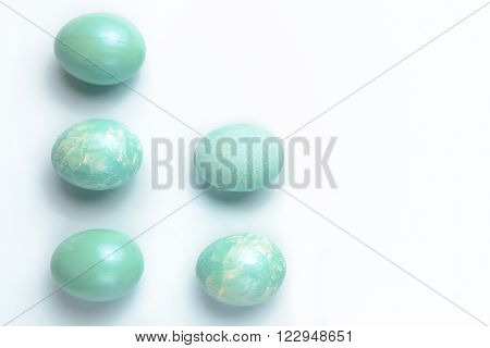 Easter decoration five turquoise eggs painted with acrylic paint