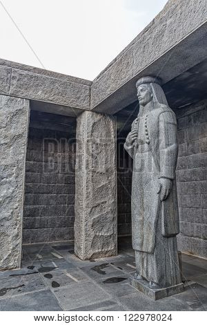 LOVCEN, MONTENEGRO - AUGUST 11, 2015: Female sculpture at the entrance of Njegos mausoleum, the work of sculptor Ivan Mestrovic.