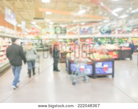 Blurred People Shopping For Fresh Fruits And Vegetables In America