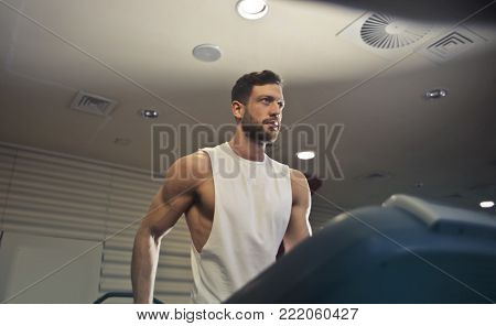 Handsome muscular man training

