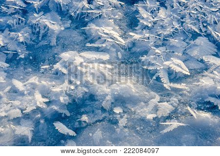 texture of ice on blue background in winter