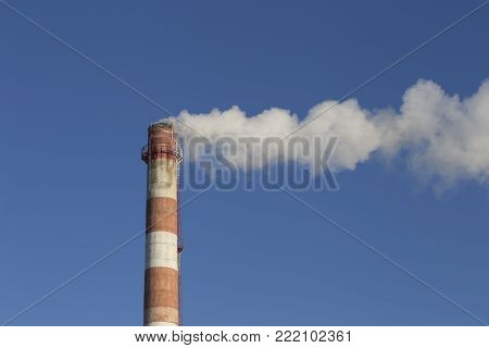 smoke tube CHP against the blue sky