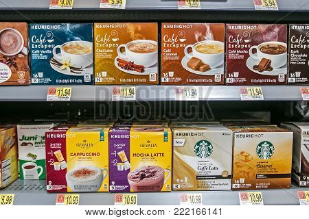 Egg Harbor Township, NJ, December 10, 2017: Packs of variously branded coffee Keurig capsules are offered for sale in a Walmart store.