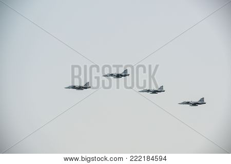 Pattaya, Thailand - November 20, 2017: Four warplanes  flying on misty sky on the 50th anniversary ASEAN international fleet review 2017 in Pattaya, Thailand