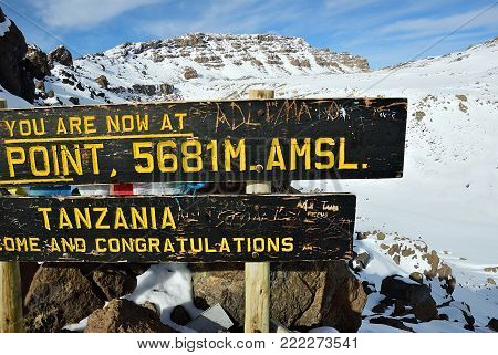 The sign on the rim of crater Gilmans Point, mountain Kilimanjaro (altitude 5681 m). Marangu route. Tanzania, Africa