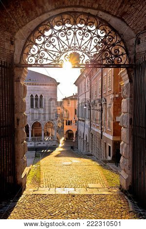 Town of Udine ancient gate aut sunset view, Piazza della Liberta square, Friuli-Venezia Giulia region of Italy