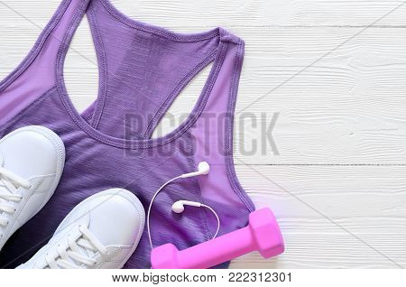 Womens fashion white clothing, shoes, accessories (white leather sneakers, sweatshirt, headphones, perfume. Fashion concept. View from above, Flat lay. Spring summer collection