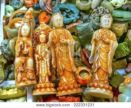 Chinese Replica Plastic Buddhas Decorations Panjuan Flea Market  Decorations Beijing China.  Panjuan Flea Curio market has many fakes, replicas and copies of older Chinese products, many ancient.