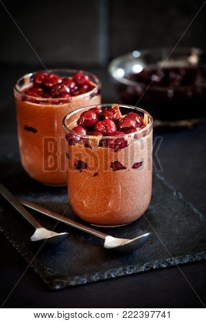 Glasses Of Chocolate Mousse With Cherry Topping