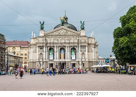 Lviv, Ukraine - May 31, 2016: People walk in front of the National Academic theatre of opera and ballet named after Solomiya Krushelnytska in cloudy weather in Lviv, Ukraine.