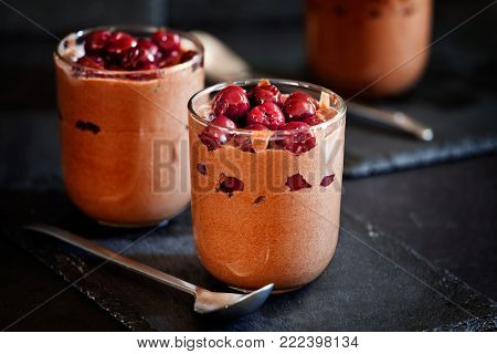 Glasses Of Chocolate Mousse With Cherry Topping