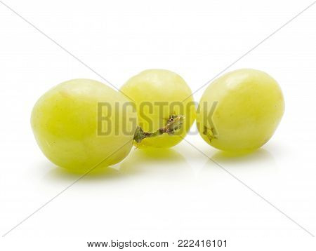 Three grape berries (Early Sweet or Grapaes variety) isolated on white background green ripe