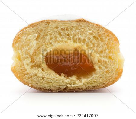 One doughnut (Sufganiyah) cross section half with apricot jam isolated on white background fresh baked with powered sugar and without hole