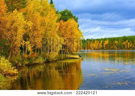 Kuusamo Lake in Finland in colorful autumn.