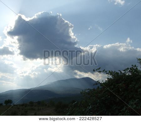 Amazing Pink cloud in the sky against the background of the mountain
