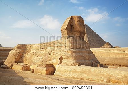 CAIRO, EGYPT - NOVEMBER 19, 2017: View of The Great Sphinx and pyramids on the Giza Plateau - one of the most famous tourist attractions in the world