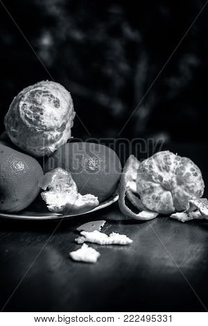 Close Up Of Fresh Ripe Oranges,citrus Aurantium In A Plate On Wooden Surface.