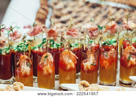 Many glass of hooch shots yellow and red, party set