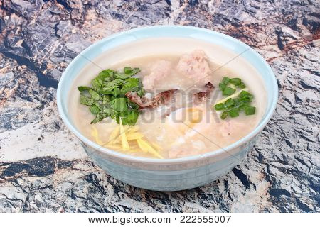 Chinese recipe,Rice porridge with  boiled egg ,Minced pork ,chicken liver, Ginger, onion and coriander .