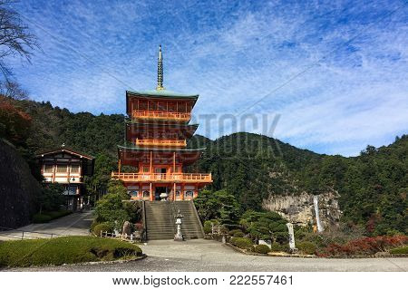 Seiganto-ji Shrine with waterfall in Wakayama, Japan. The temple is registered as a UNESCO World Heritage site as part of Sacred Sites and Pilgrimage Routes.