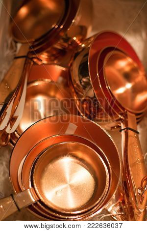 Copper Measuring Cups/spoons In Sets Of Different Sizes On Display