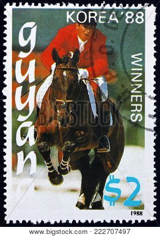 GUYANA - CIRCA 1988: a stamp printed in Guyana shows equestrian, 1988 Summer Olympics, Korea, circa 1988