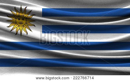 Realistic flag of Uruguay on the wavy surface of fabric. This flag can be used in design