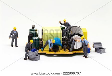 Workers repair computer detail. Miniature worker figurine and micro chip. Men at work macro photo. Computer repair banner template. Fixing electronic hardware. Computer industry. Semiconductor closeup
