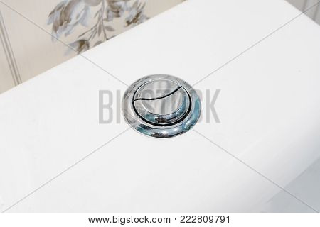 Flushing toilet button in the toilet (restroom), toilet flush knob with two separate buttons of normally and water saving button