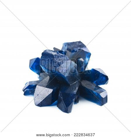Grown crystal of blue colored salt isolated over the white background