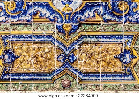 Detail of traditional  tiles on facade of old house