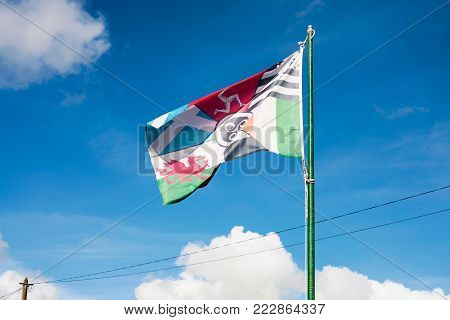 travel to France - view of pan-celtic flag made up from the flags of the six celtic and galician nations on street in Ploubazlanec town in Brittany