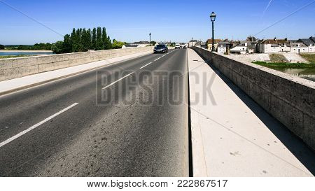 Travel to France - car traffic on bridge Pont du Marechal Leclerc route D431 over Loire river in Amboise town in Val de Loire region in sunny summer day