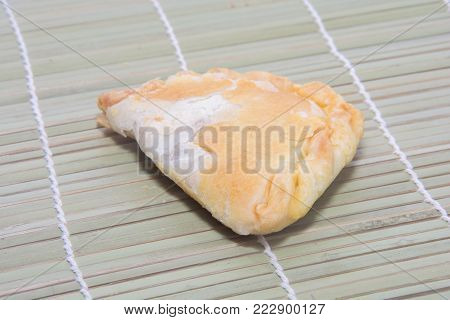 close up of curry puff on white background
