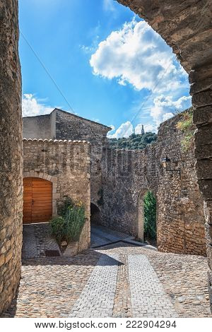 Impression of the village Viviers with the Virgin Mary statue on the mountain top in the Ardeche region of France
