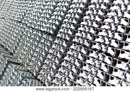 metal structures in a warehouse in stacks. metal supports for scaffolding and formwork. soft focus and bokeh.Outdoors storage of building materials and metal structures.