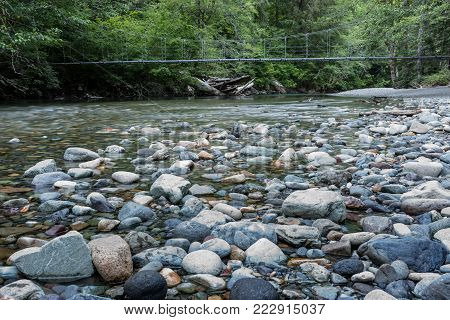 Suspension Bridge Over Rocky Creek in the Cascade mountains
