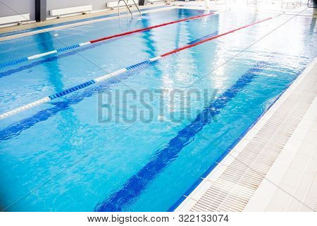 Indoor Swimming Pool, Healthy Concept.swiming Pool For Competition.pool With Swim Lanes. Sport And E