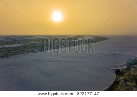 Dim winter morning in Lapland. Unforgettable excursion to the arctic tourist cruise on the sea icebound. The concept of active and extreme tourism