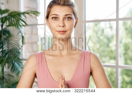 Woman Holding Her Hands Together In Amen Gesture