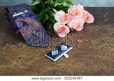 Roses On Rusty Table With Gray Background