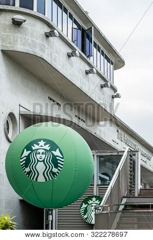 Singapore - March 20, 2019: Large Green Balloon With Starbucks Logo At The Gray Building Called The 